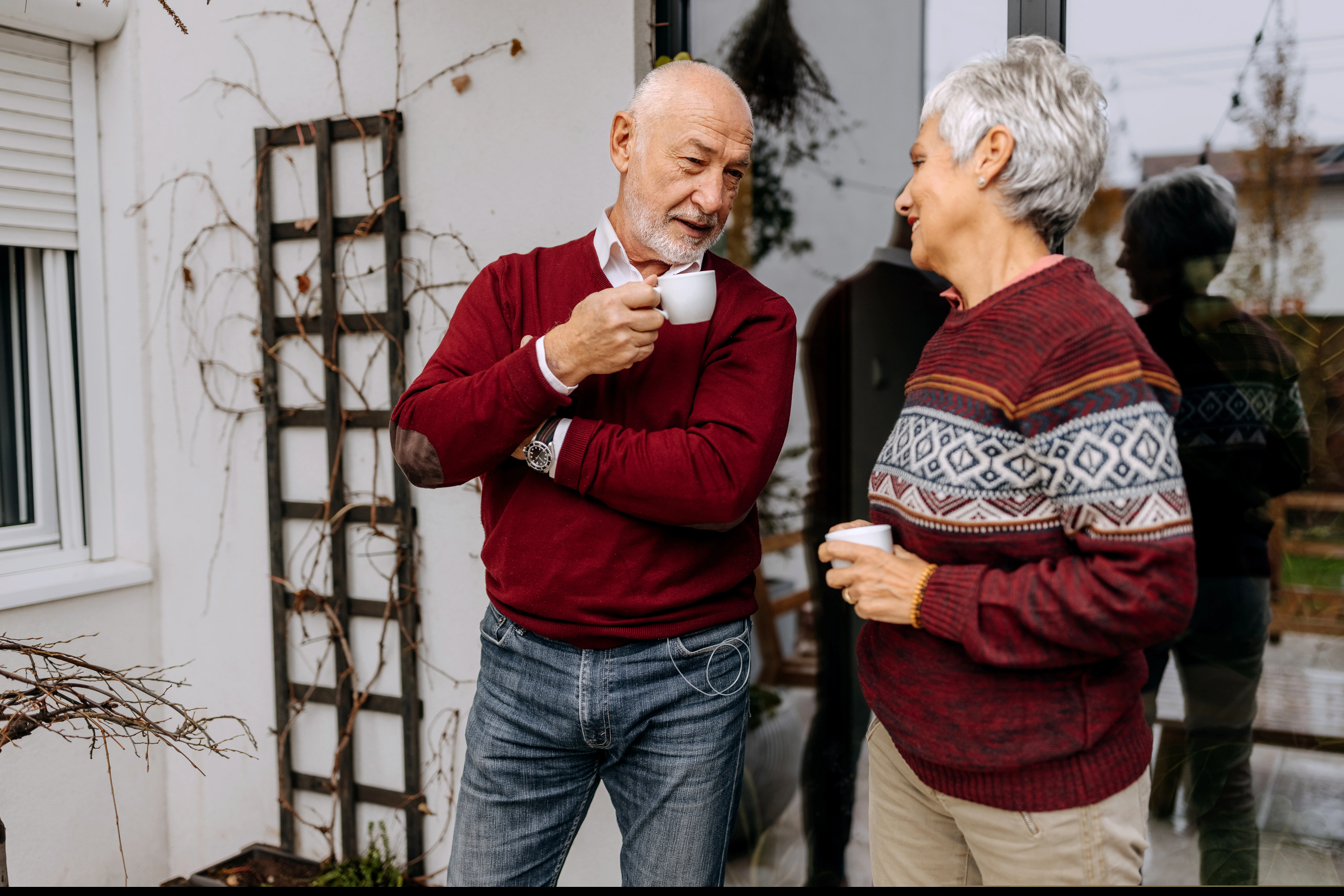 a man and woman holding cups