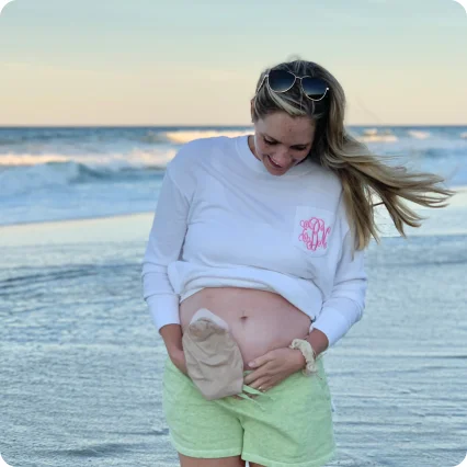A woman is living with an ostomy bag