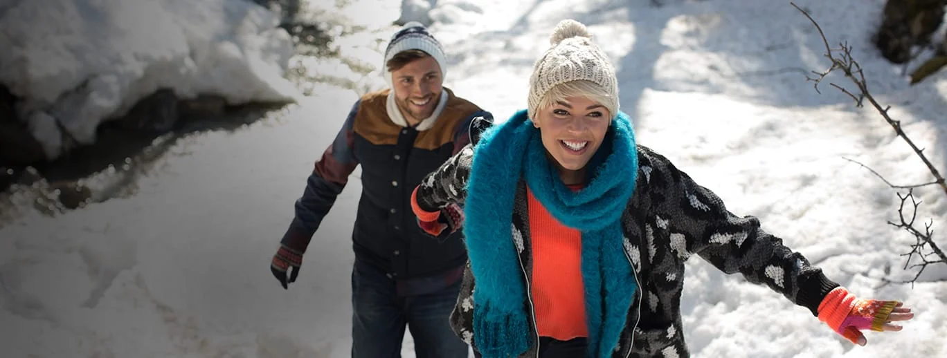 a couple of people in the snow